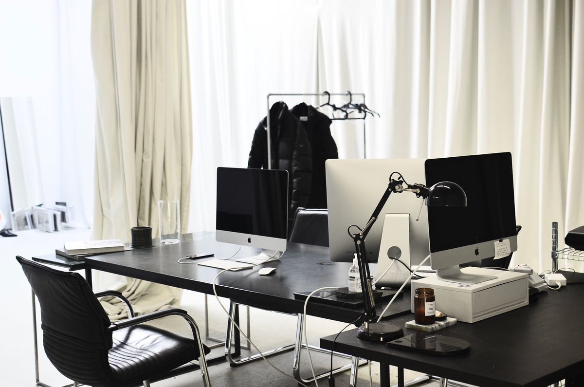 A bright, modern office with computers on the desks